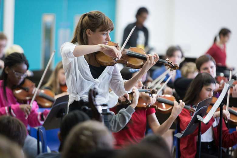 Nicola Benedetti performing with six schools from across London at the inaugural Music in Secondary Schools Trust concert earlier this month (photo Benjamin Ealovega)