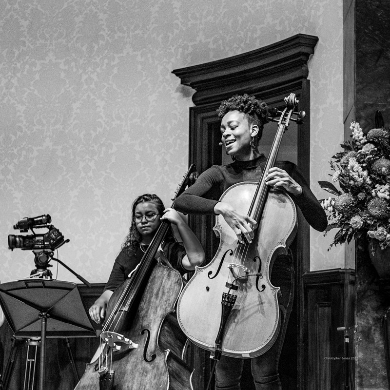 Ayanna Witter-Johnson (voice, cello, piano, composition) and Thea Sayer (double bass) rehearsing for a concert featuring works by Witter-Johnson with a variety of guest performers (May 2022).