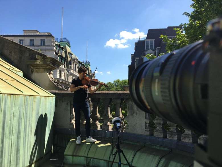 Up on the roof: Lawrence Power plays Huw Watkin's new piece for solo violin, 'Power', atop St John's Smith Square (Photo: Jessie Rodger) 