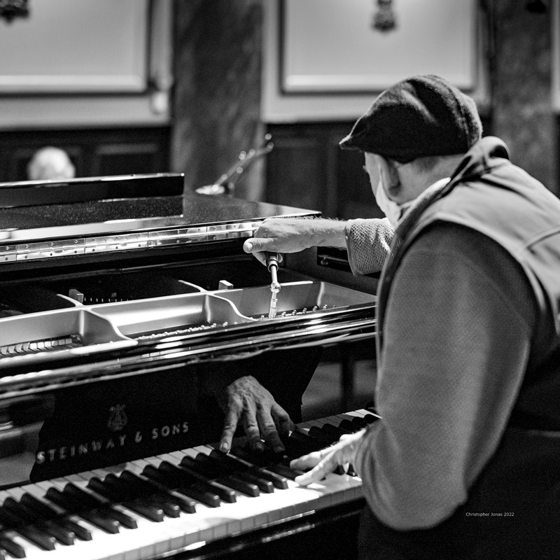 Branko Pajevic tunes the Wigmore Hall's Steinway piano;  one of two pianos kept under the stage in the auditorium before the evening concert.