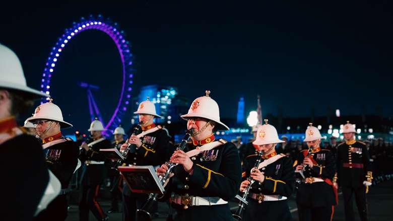 The Royal Marines Band Service rehearse for the Coronation with the London Eye in the background