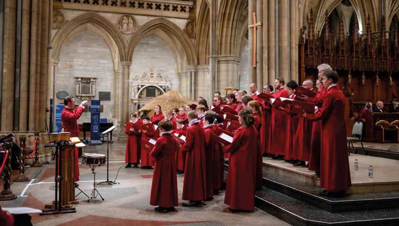 Christopher Gray conducts the Choir of Truro Cathedral in a Christmas concert; it was at Truro that the Service of Nine Lessons and Carols originated
